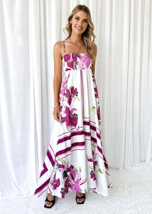Detailed pattern of floral and geometric prints on white summer bohemian maxi dress