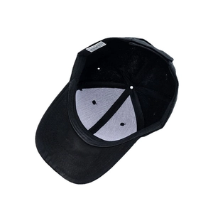 Internal view of a black cotton baseball cap showing stitching and breathable vents