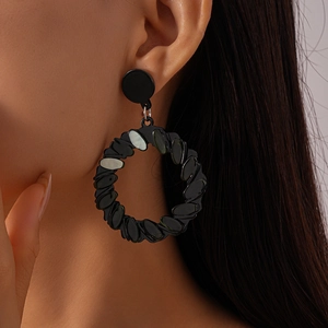 Geometric black acrylic circular drop earrings with marbled accents for women
