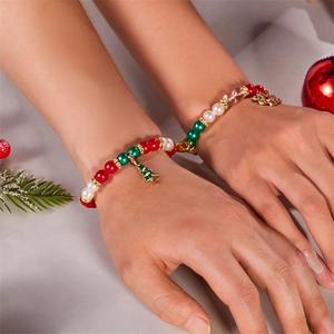 Christmas couple bracelets set with snowflake and tree pendants worn on wrist