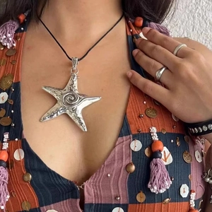 Y2K vintage oversized silver starfish pendant necklace with swirl pattern on black cord