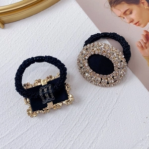 Detail of luxury rhinestone hair ties set with oval and rectangular crystal motifs