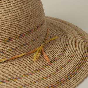 Handwoven raffia straw sun hat with colorful decorative bands and wide brim for summer