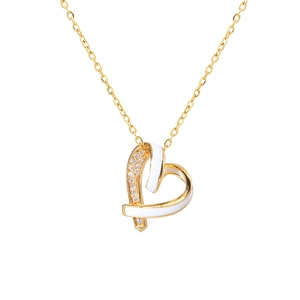 Elegant gold heart necklace with white enamel and sparkling zircon on white background