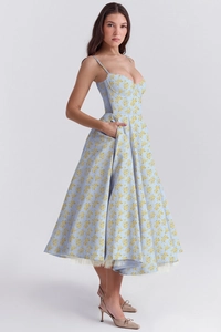 Detail of light blue floral dress with heart neckline and delicate white mesh lining