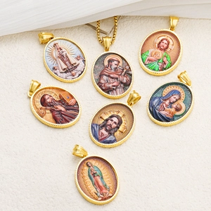 Detailed view of oval 18k gold-plated stainless steel religious enamel pendants with saints