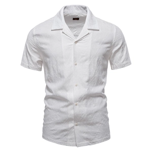 Macro detail of geometric jacquard fabric texture on a white short-sleeve shirt