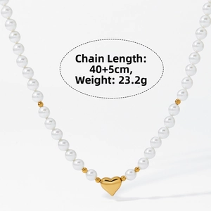 Detail of elegant pearl necklace with gold heart pendant showing 40+5cm length specs