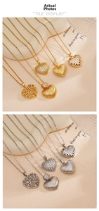 Detail view of heart pendants in gold and silver finish with cubic zirconia inlay