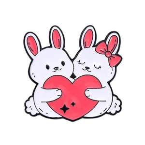 Cute cartoon enamel bunny pin featuring two white rabbits holding a pink heart on white background