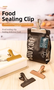 Macro shot of colorful stainless steel food clips showing gold and silver metallic finishes