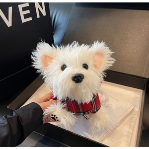 Close-up of white plush Westie dog bag with red tartan scarf in a premium gift box