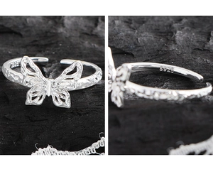 Close-up of S925 sterling silver butterfly ring showing texture and hallmark engraving