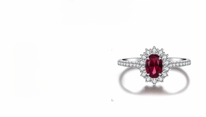 Detail view of S925 sterling silver ring with 1ct oval red gemstone and halo settings