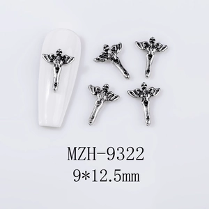 Macro view of 9x12.5mm retro silver winged skull cross alloy nail art charms
