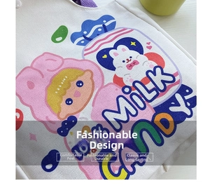 Close-up of Milk Candy cartoon print and woven texture on a white canvas tote bag