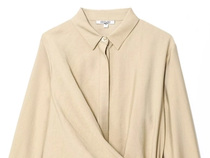 Close-up of khaki long-sleeve shirt collar and overlap design with golden buttons