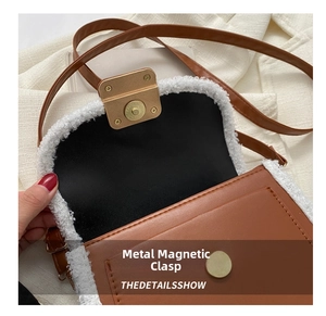 Detail shot of the magnetic snap closure and lamb wool trim on the brown crossbody bag
