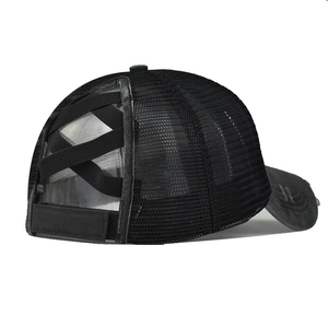 Detail of black mesh ponytail cap with elastic criss-cross back and velcro strap