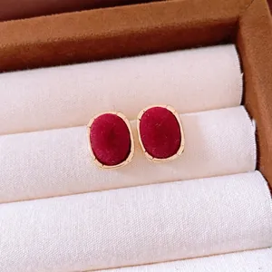 Vintage burgundy flocked oval stud earrings with gold metal frame for elegant winter style