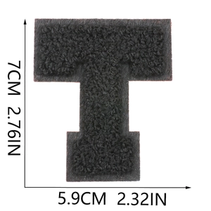 Detailed dimension view of black chenille letter T patch with embroidery texture