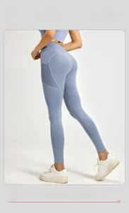 Detail of high waist yoga leggings featuring side mesh panels and functional side pockets