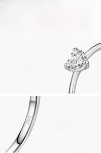 Macro shot of S925 sterling silver ring showing the 5A heart-shaped zircon and hallmark