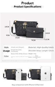 Detail view of black heart quilted shoulder bag with dimensions and gold swan charm