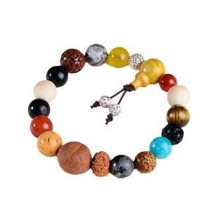 Traditional Eighteen Seeds Bodhi Bracelet with multicolored beads on a white background