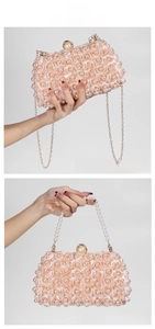 Detail of pink floral evening bag with faux pearls and gold metal chain strap