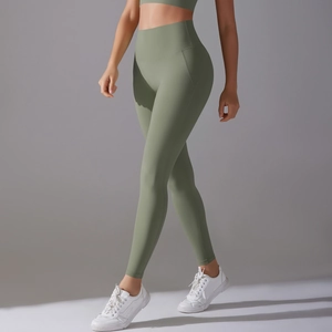 Close-up of olive green high-waist yoga pants with seamless high-elasticity fabric texture
