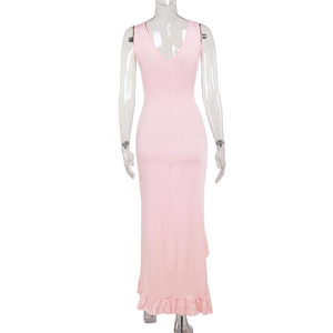 Detail view showing the V-neck back and ruffled hem of the pink slim fit maxi dress