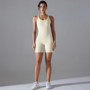 Close-up of beige high-elasticity yoga bodysuit with U-neckline and slim fit design