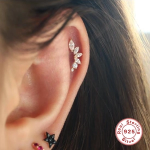 S925 sterling silver marquise petal stud earring on model's cartilage with gold finish