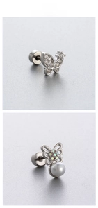 Detail showing butterfly earrings with purple zircon crystals and faux pearl pendant