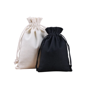 Minimalist cotton canvas drawstring pouches in cream and black for jewelry storage