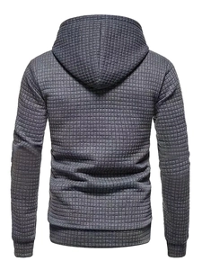 Detailed view of dark grey men's hoodie featuring premium 3D waffle texture fabric