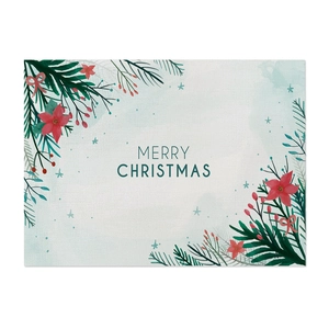 Detail of waterproof linen placemat with Merry Christmas print and pine leaf motifs