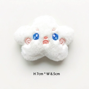 Detail of plush white star charm with cute embroidery and 7cm by 8.5cm size scale