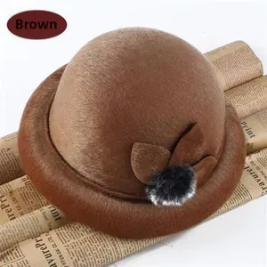 Detailed side view of khaki wool bucket hat featuring leaf decoration and small fur pompon