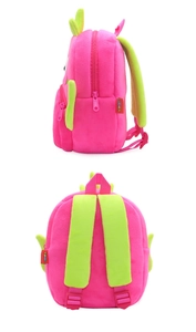 Detail view of pink plush cartoon backpack with adjustable lime green straps and back