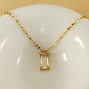 18K gold stainless steel necklace with square zircon pendant displayed on a white plate