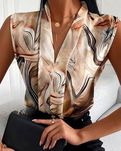 Detail of V-neck sleeveless chiffon top featuring brown abstract marble fluid patterns
