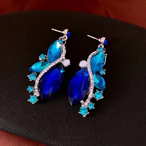 Elegant silver-toned water drop earrings with blue marquise rhinestones and white beads