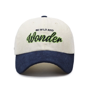 Corduroy baseball cap with 'BE WILD AND Wonder' embroidery in cream and navy