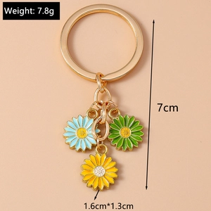 Detail view of daisy keychain with blue, green and yellow flower pendants and dimensions