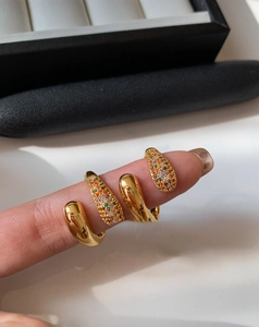 Detailed macro of gold plated spiral ring with multi-color micro-set zircon stones