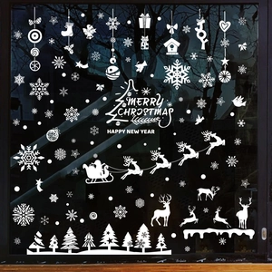 White Christmas window stickers featuring snowflakes, reindeer and Merry Christmas text