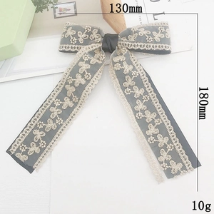 Grey lace mesh bow accessory with white trim, sized 130mm x 180mm and weighs 10g