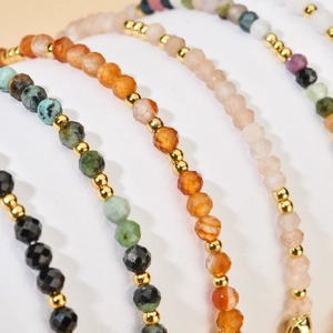 Colorful natural stone beaded bracelet with faceted crystals and gold stainless steel accents